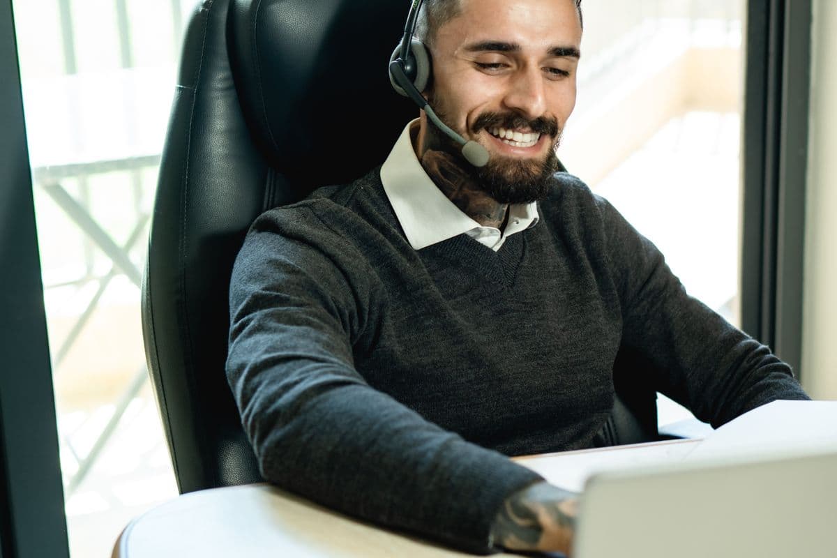 A specialist providing support over a headset